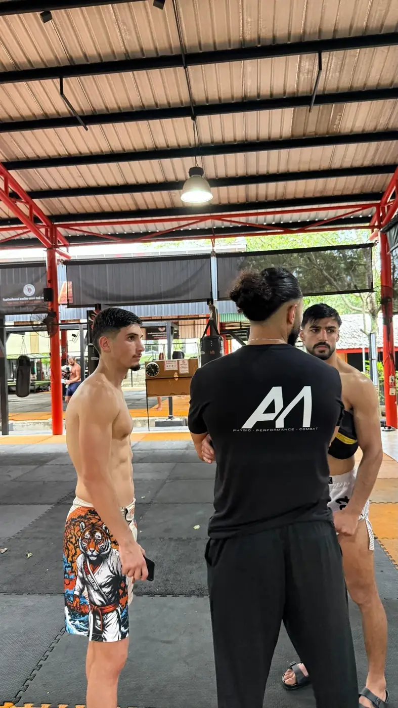Physio coach preparing combat athletes during training