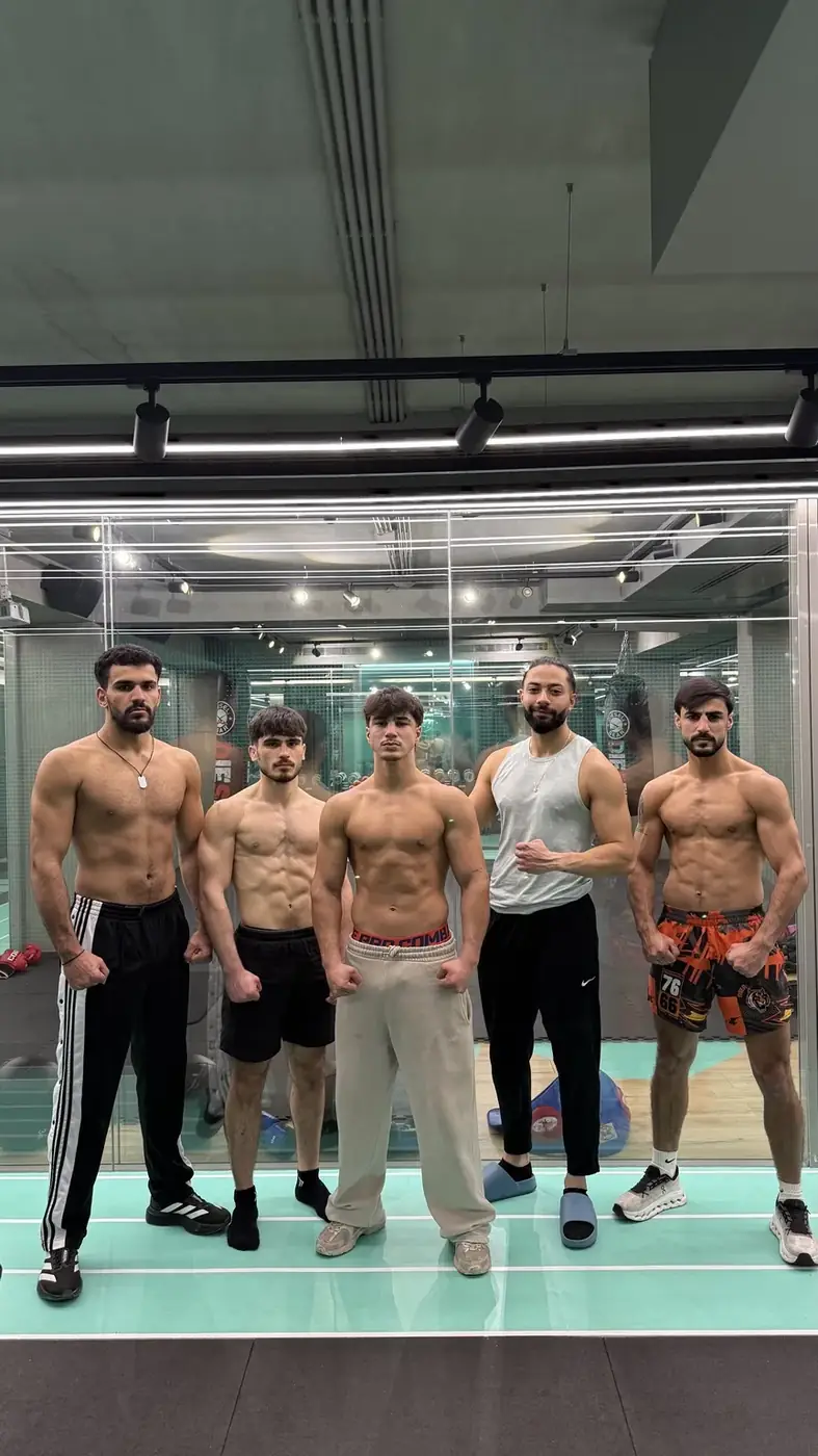 Combat athletes and coach during fight preparation